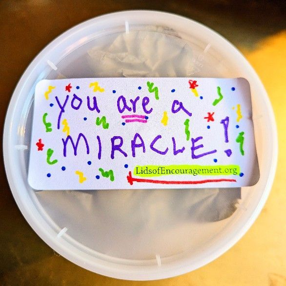 A container with a sticker that says you are a miracle