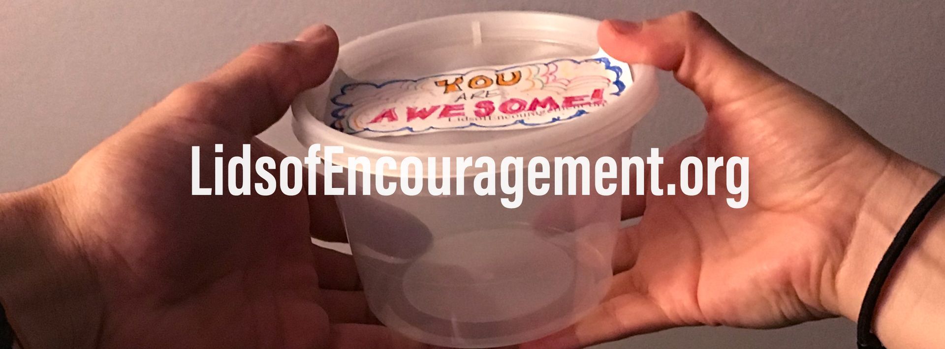 A person is holding a cup that says awesome on it